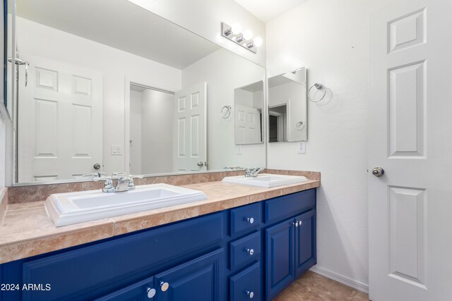 bathroom with tile patterned floors and vanity