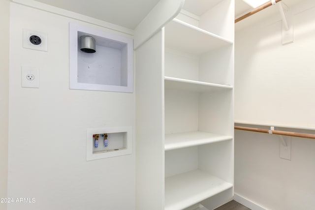 clothes washing area with washer hookup and hookup for an electric dryer