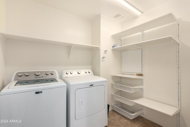 clothes washing area with washer and dryer