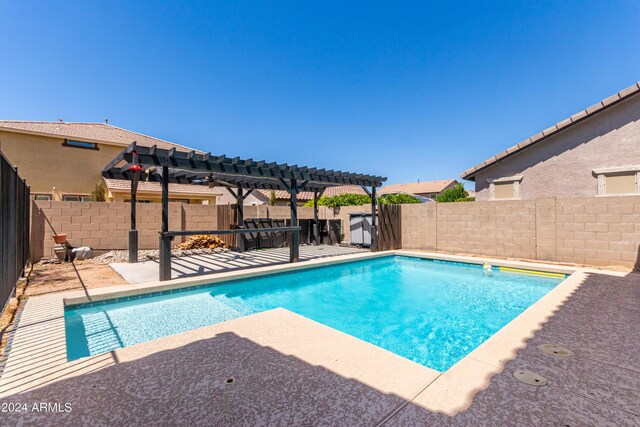 view of pool featuring a pergola and a patio