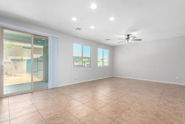 unfurnished room with light tile patterned flooring and ceiling fan