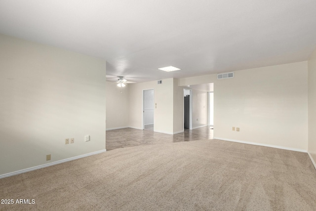 13842 N Tan Tara Dr, Sun City, AZ 85351 - carpeted spare room with baseboards, ceiling fan, and visible vents