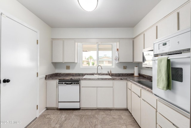 13842 N Tan Tara Dr, Sun City, AZ 85351 - kitchen featuring a sink, dark countertops, and white appliances