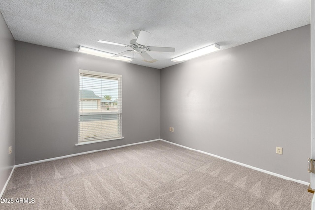 13842 N Tan Tara Dr, Sun City, AZ 85351 - unfurnished room featuring carpet flooring, a ceiling fan, baseboards, and a textured ceiling