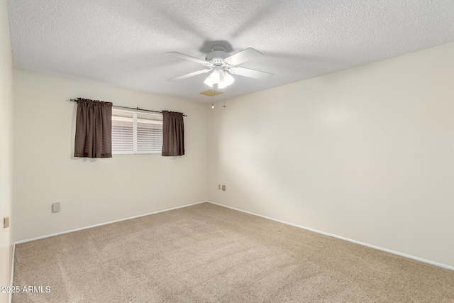 13842 N Tan Tara Dr, Sun City, AZ 85351 - carpeted empty room with baseboards, ceiling fan, and a textured ceiling