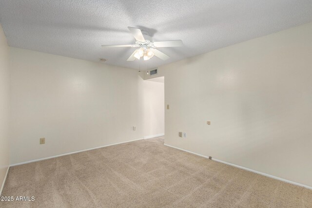13842 N Tan Tara Dr, Sun City, AZ 85351 - carpeted empty room with baseboards, a textured ceiling, visible vents, and a ceiling fan