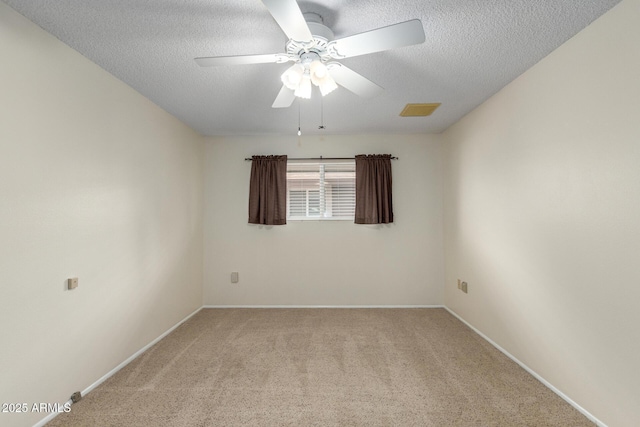 13842 N Tan Tara Dr, Sun City, AZ 85351 - spare room with a textured ceiling, visible vents, baseboards, ceiling fan, and light carpet