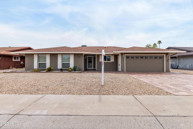 13842 N Tan Tara Dr, Sun City, AZ 85351 - ranch-style home featuring driveway, an attached garage, and brick siding