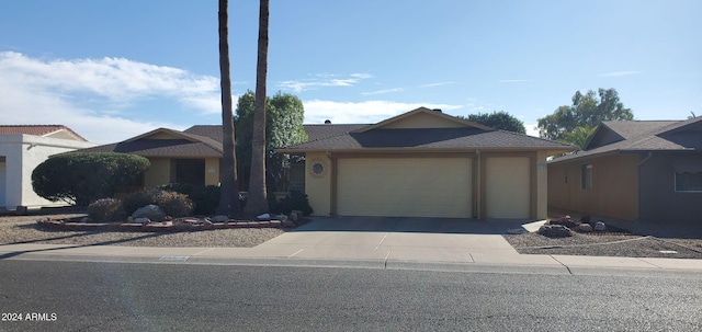 single story home featuring a garage