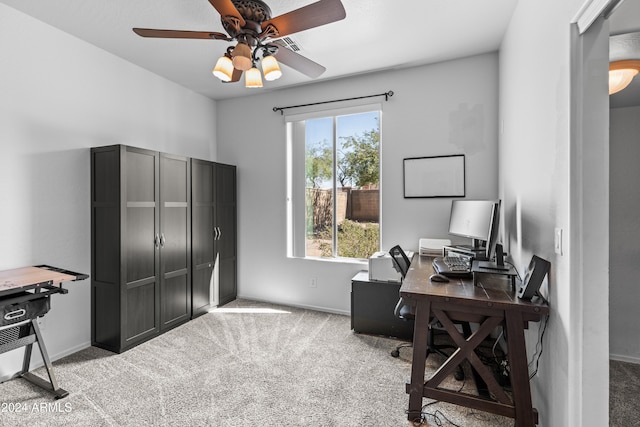 carpeted home office with ceiling fan