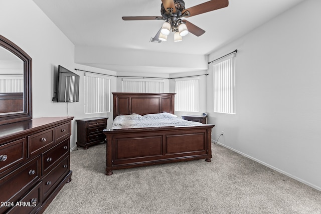 bedroom with light colored carpet and ceiling fan