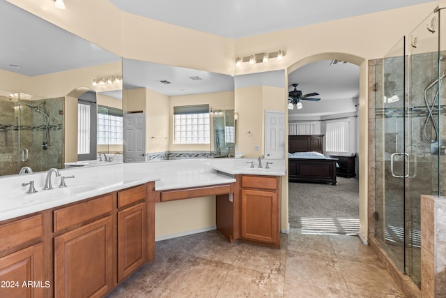 bathroom featuring walk in shower, tile patterned floors, vanity, and ceiling fan