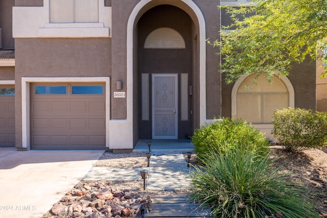 doorway to property featuring a garage