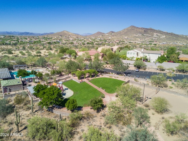 birds eye view of property featuring a mountain view