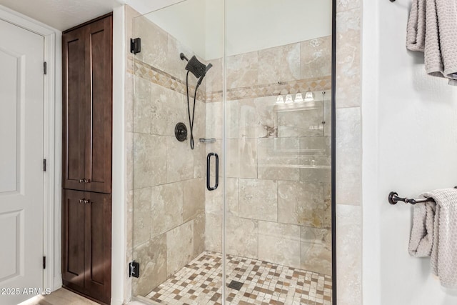 full bath featuring a shower stall