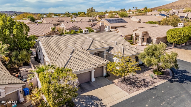 birds eye view of property with a residential view