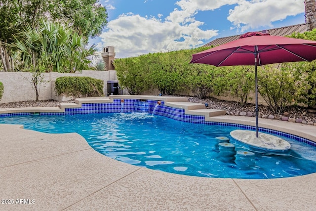 view of swimming pool with fence and a fenced in pool