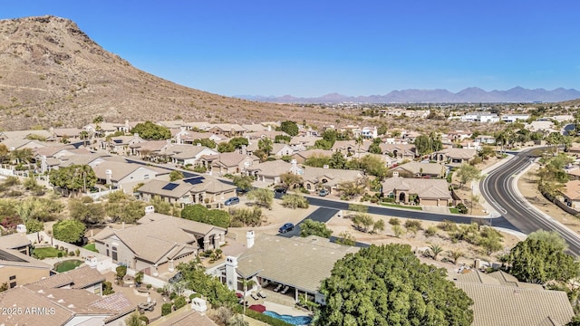 birds eye view of property with a mountain view and a residential view