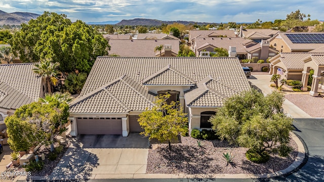 drone / aerial view with a mountain view and a residential view