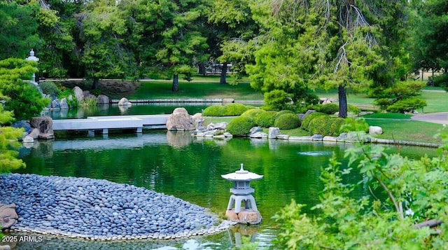 surrounding community featuring a water view