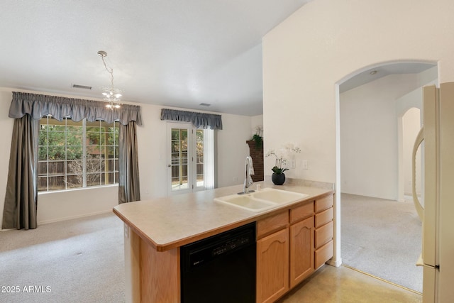 kitchen with arched walkways, freestanding refrigerator, a sink, black dishwasher, and light colored carpet