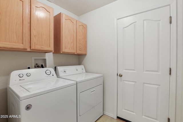 laundry area featuring cabinet space and washing machine and clothes dryer