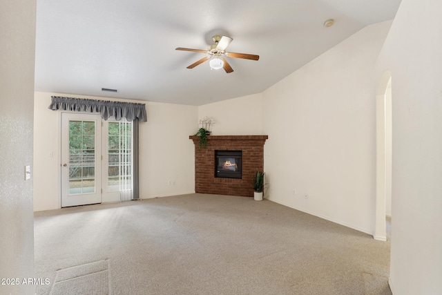 unfurnished living room with visible vents, carpet floors, ceiling fan, and vaulted ceiling