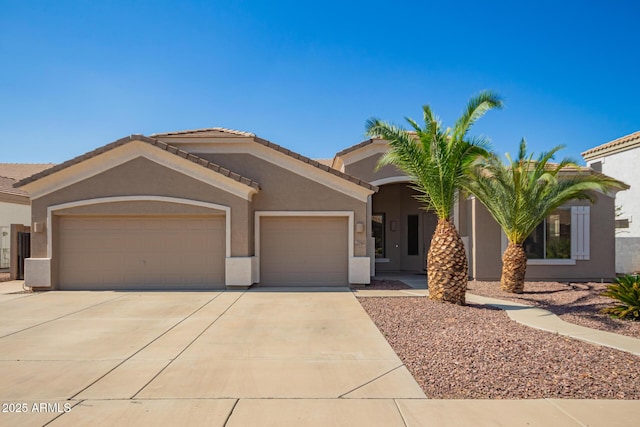 2945 E Clifton Ave, Gilbert, AZ 85295 - view of front facade with an attached garage, stucco siding, concrete driveway, and a tile roof