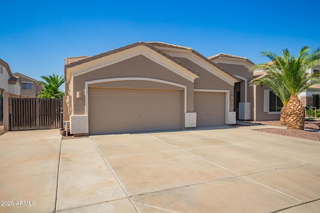 2945 E Clifton Ave, Gilbert, AZ 85295 - view of front facade with stucco siding, an attached garage, and concrete driveway
