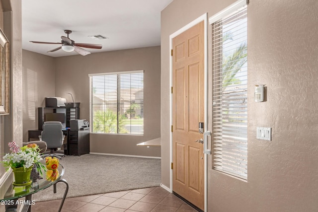 2945 E Clifton Ave, Gilbert, AZ 85295 - tiled foyer featuring a textured wall, carpet flooring, a ceiling fan, and baseboards
