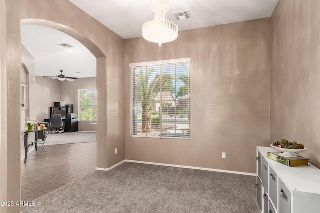 2945 E Clifton Ave, Gilbert, AZ 85295 - tiled dining area with arched walkways, a desk, carpet floors, ceiling fan, and baseboards