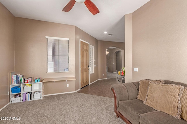 2945 E Clifton Ave, Gilbert, AZ 85295 - carpeted living room featuring arched walkways, a ceiling fan, and baseboards
