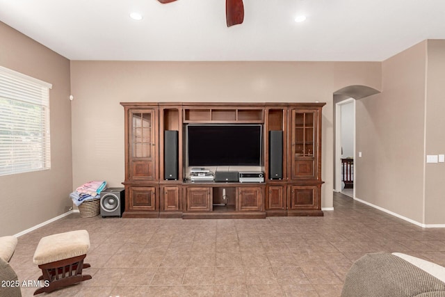 2945 E Clifton Ave, Gilbert, AZ 85295 - living area featuring arched walkways, ceiling fan, baseboards, light tile patterned floors, and recessed lighting