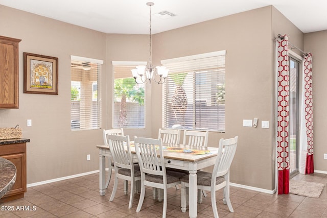 2945 E Clifton Ave, Gilbert, AZ 85295 - dining space featuring light tile patterned floors, a chandelier, and baseboards
