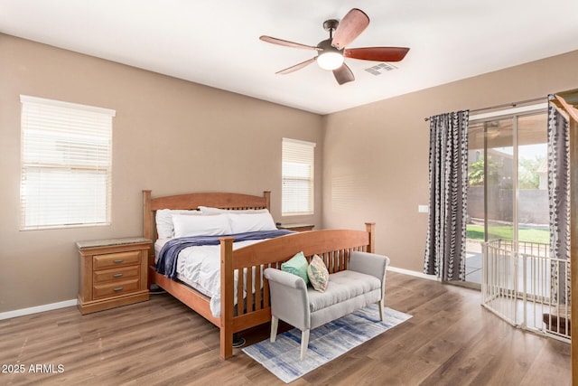 2945 E Clifton Ave, Gilbert, AZ 85295 - bedroom with access to outside, multiple windows, light wood-style flooring, and baseboards