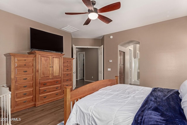 2945 E Clifton Ave, Gilbert, AZ 85295 - bedroom with arched walkways, wood finished floors, and a ceiling fan