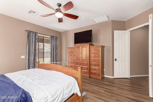 2945 E Clifton Ave, Gilbert, AZ 85295 - bedroom with wood finished floors, baseboards, and a ceiling fan