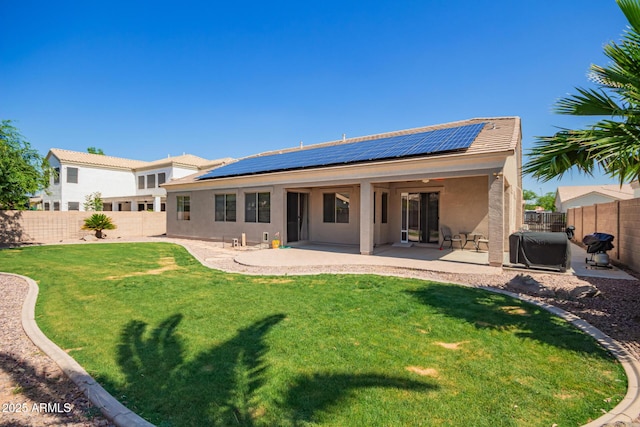 2945 E Clifton Ave, Gilbert, AZ 85295 - rear view of property featuring stucco siding, a patio, and roof mounted solar panels