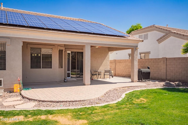 2945 E Clifton Ave, Gilbert, AZ 85295 - back of property with roof mounted solar panels, a patio, and stucco siding