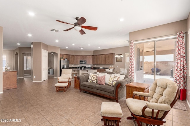 2945 E Clifton Ave, Gilbert, AZ 85295 - living area with a ceiling fan, arched walkways, recessed lighting, a chandelier, and baseboards