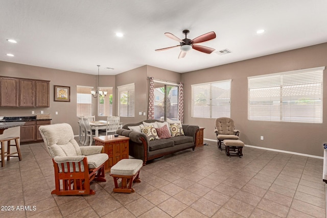 2945 E Clifton Ave, Gilbert, AZ 85295 - living area featuring light tile patterned floors, ceiling fan, recessed lighting, and plenty of natural light