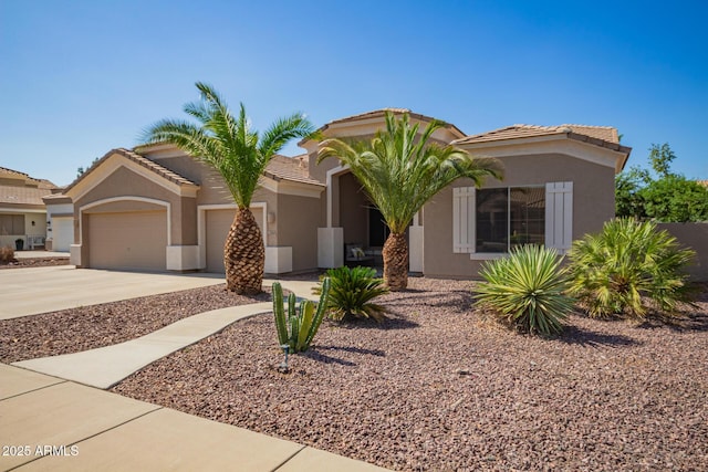 2945 E Clifton Ave, Gilbert, AZ 85295 - view of front of house featuring concrete driveway, an attached garage, stucco siding, and a tiled roof