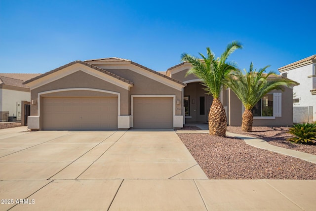 2945 E Clifton Ave, Gilbert, AZ 85295 - view of front of home with an attached garage, stucco siding, concrete driveway, and a tile roof