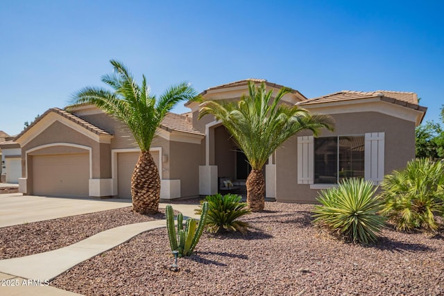 2945 E Clifton Ave, Gilbert, AZ 85295 - view of front of property featuring an attached garage, stucco siding, concrete driveway, and a tiled roof
