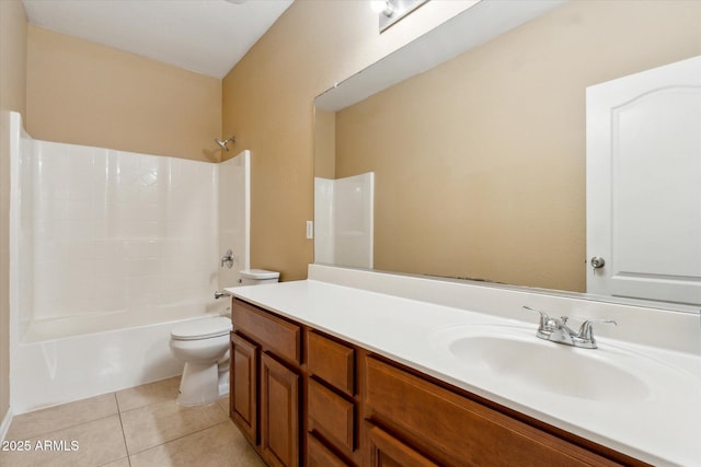 bathroom with toilet, tile patterned flooring, vanity, and tub / shower combination