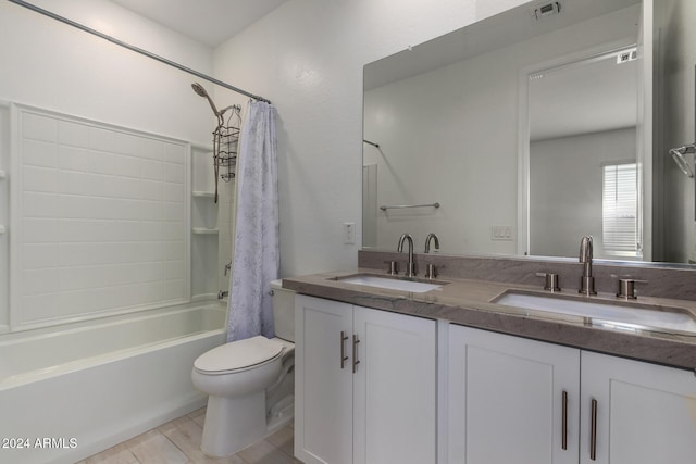 full bathroom featuring vanity, toilet, wood-type flooring, and shower / bath combo