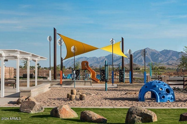 view of playground featuring a mountain view