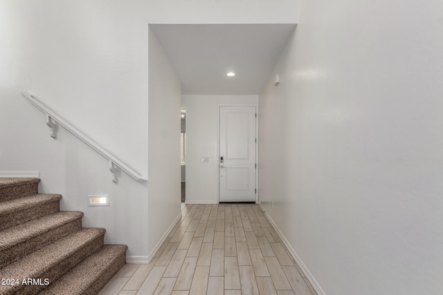 hallway with light wood-type flooring