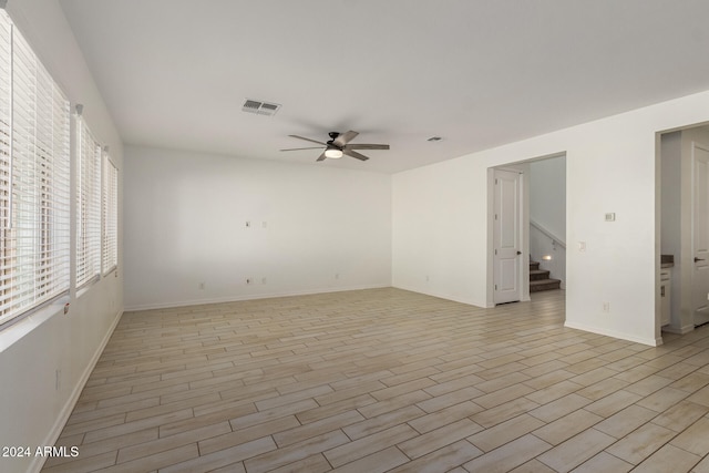 unfurnished room featuring light hardwood / wood-style flooring and ceiling fan