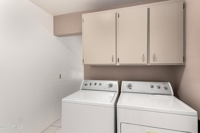 laundry room featuring cabinet space, independent washer and dryer, marble finish floor, and baseboards